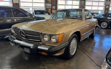 Mercedes-benz-benz-560-class-1987-yellow-1