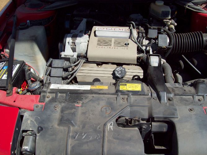 Buick-Reatta-1988-Red-Sadle-2