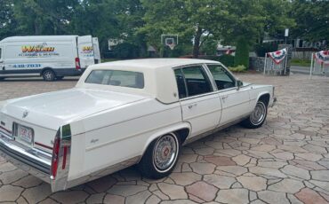 Cadillac-Brougham-1988-White-Maroon-1