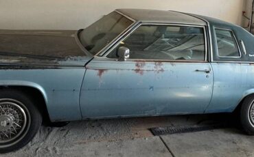 Cadillac-coupe-deville-1977-blue-13