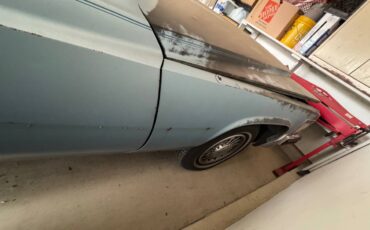 Cadillac-coupe-deville-1977-blue-3