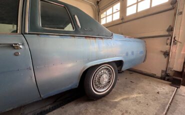 Cadillac-coupe-deville-1977-blue-8