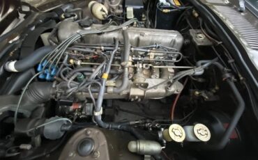 Datsun-280z-1975-Brown-Tope-Black-10