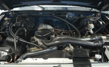 Ford-Bronco-1990-Dark-Shadow-Blue-Met-Tan-Mocha