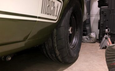 Ford-Mustang-mach-1-1973-Ivy-glow-metalic-Black-25
