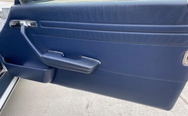Mercedes-benz-560sl-1986-Artic-white-Blue-15