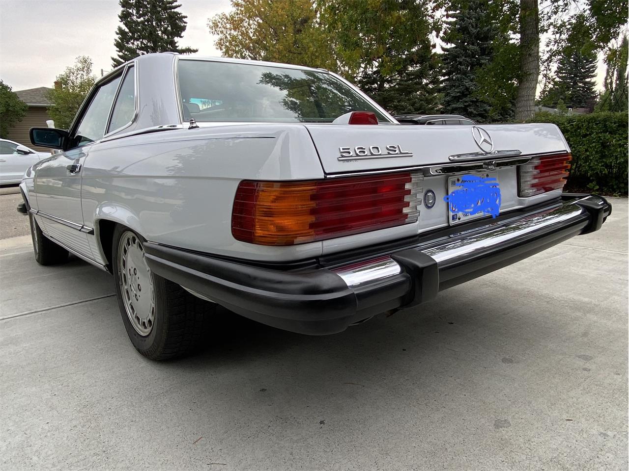 Mercedes-benz-560sl-1986-Artic-white-Blue-19