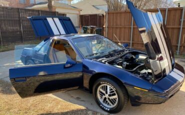 Pontiac-Fiero-1984-Blue-Tan-23