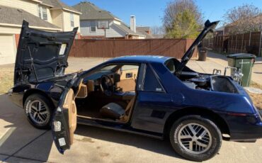 Pontiac-Fiero-1984-Blue-Tan-27