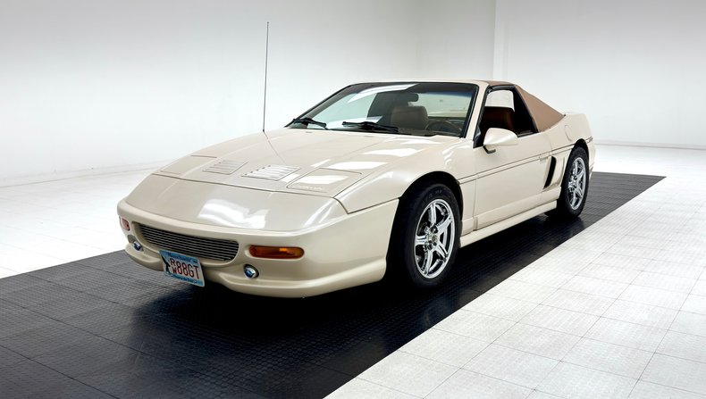 Pontiac-Fiero-1988-Pearl-White-Saddle-45
