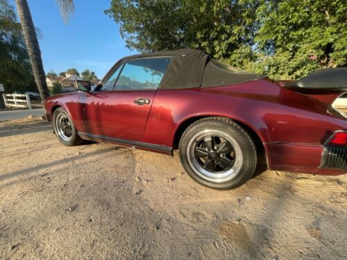 Porsche-911-1983-Ruby-Red-Metallic-Sand-Beige-Leather