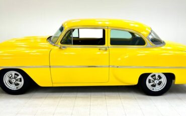 Unknown-210-1953-Yellow-Black