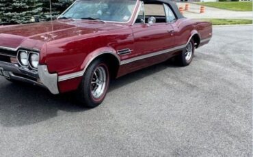 Unknown-Cutlass-1966-MaroonBlack-Top-Black-Vinyl-8
