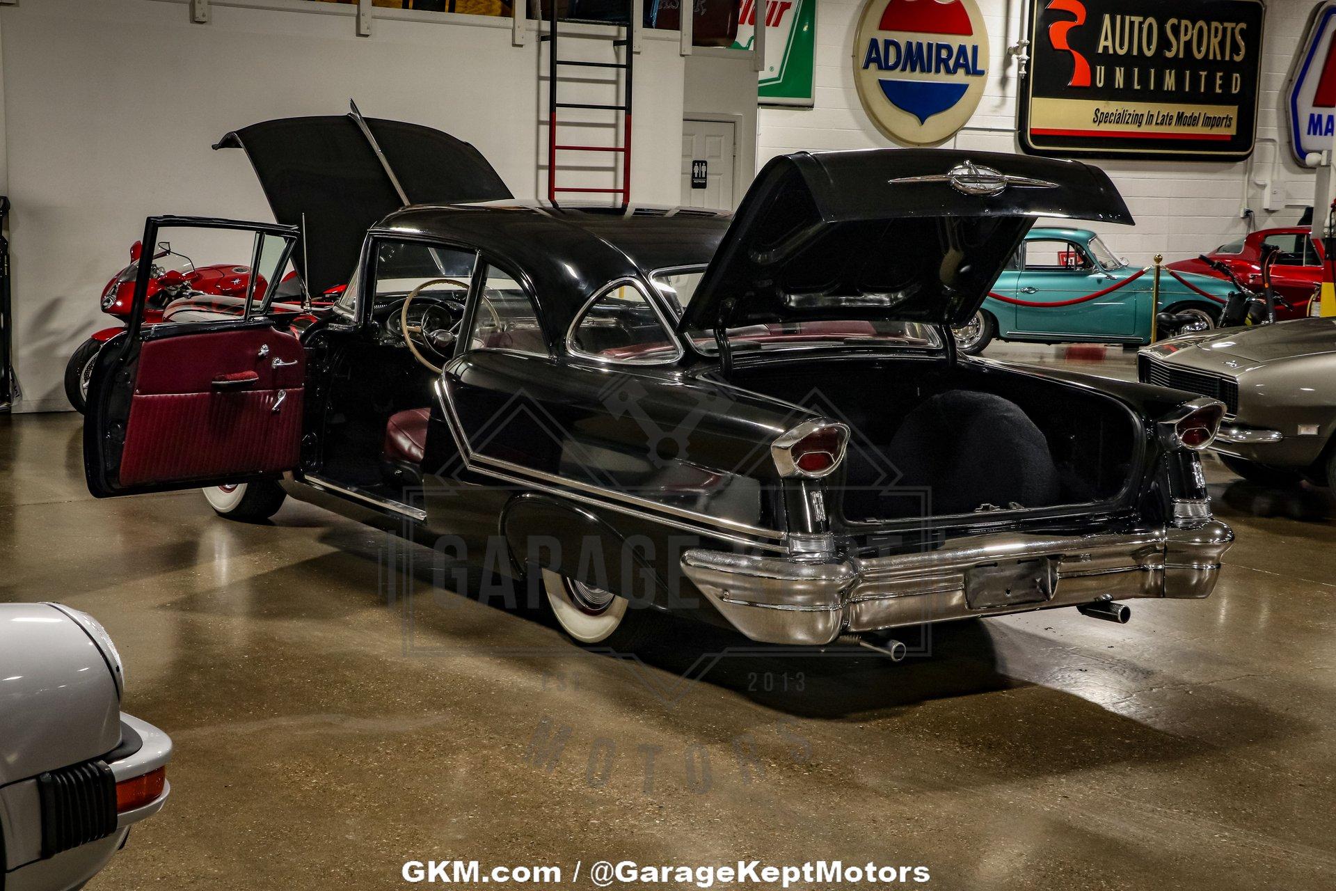 Unknown-Golden-rocket-88-1957-Black-Red-1