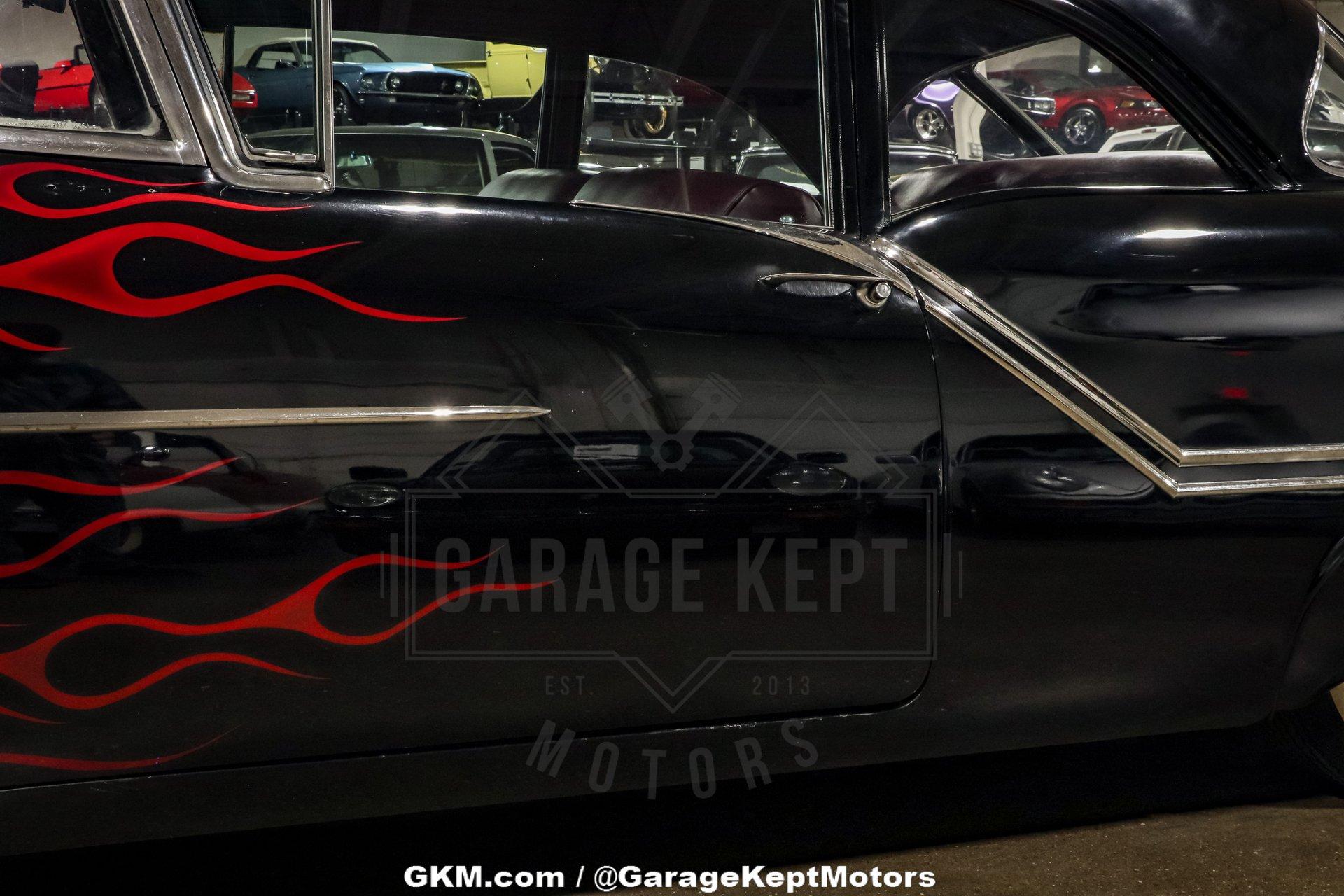 Unknown-Golden-rocket-88-1957-Black-Red-17