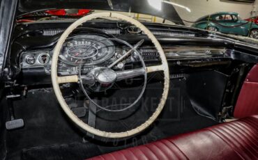 Unknown-Golden-rocket-88-1957-Black-Red-2