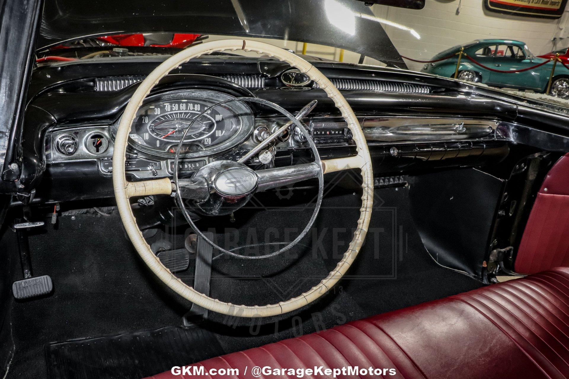 Unknown-Golden-rocket-88-1957-Black-Red-2