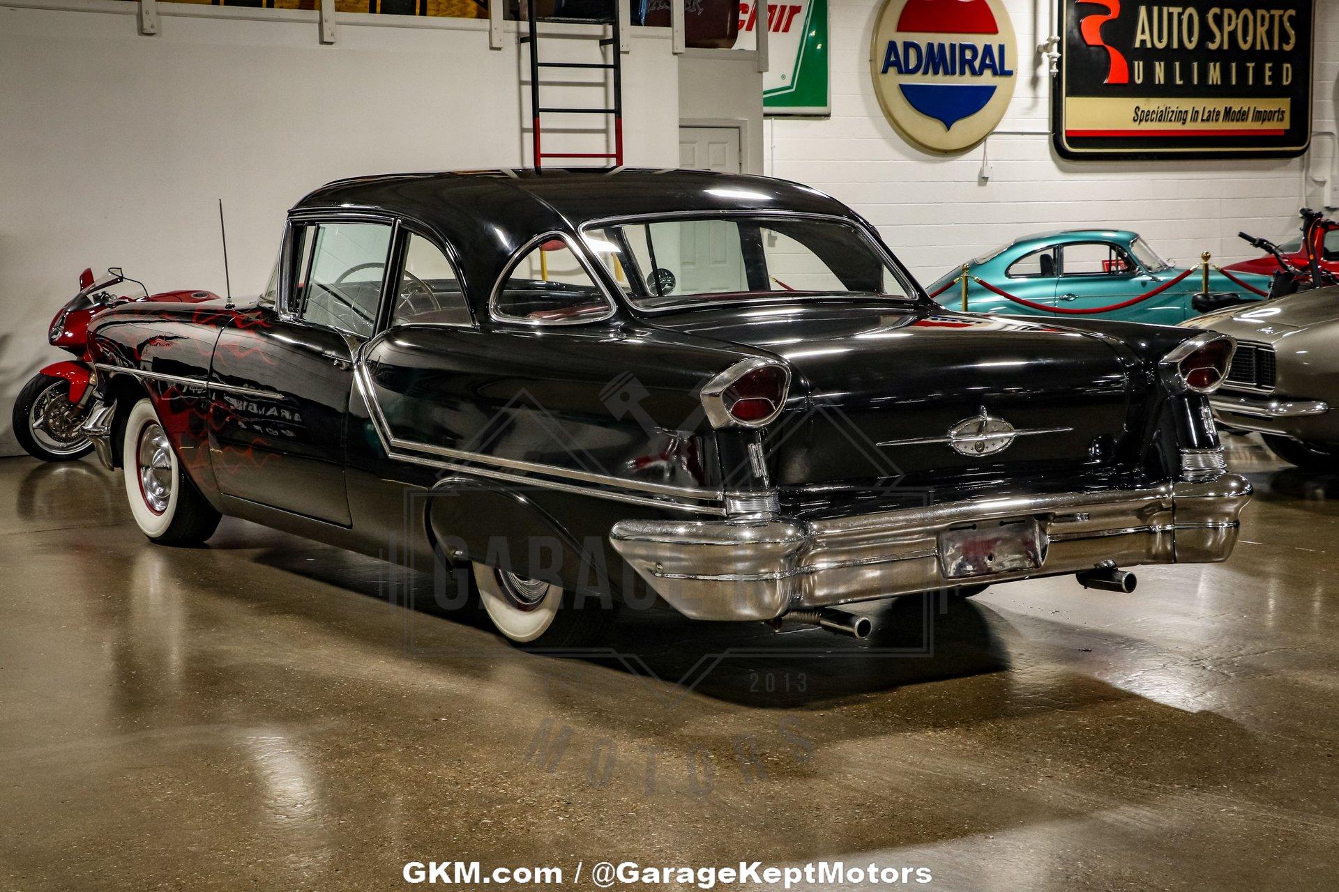 Unknown-Golden-rocket-88-1957-Black-Red-20