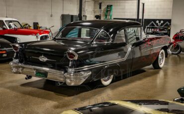 Unknown-Golden-rocket-88-1957-Black-Red-21