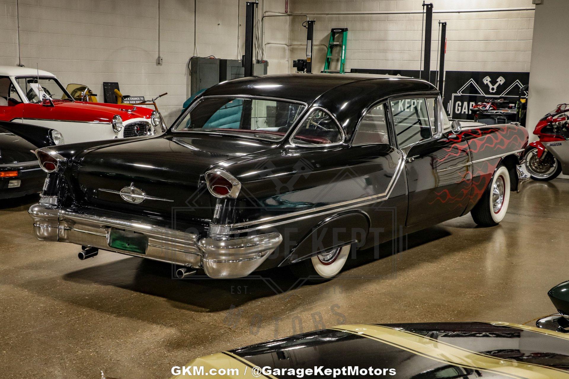 Unknown-Golden-rocket-88-1957-Black-Red-21