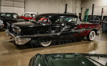 Unknown-Golden-rocket-88-1957-Black-Red-22