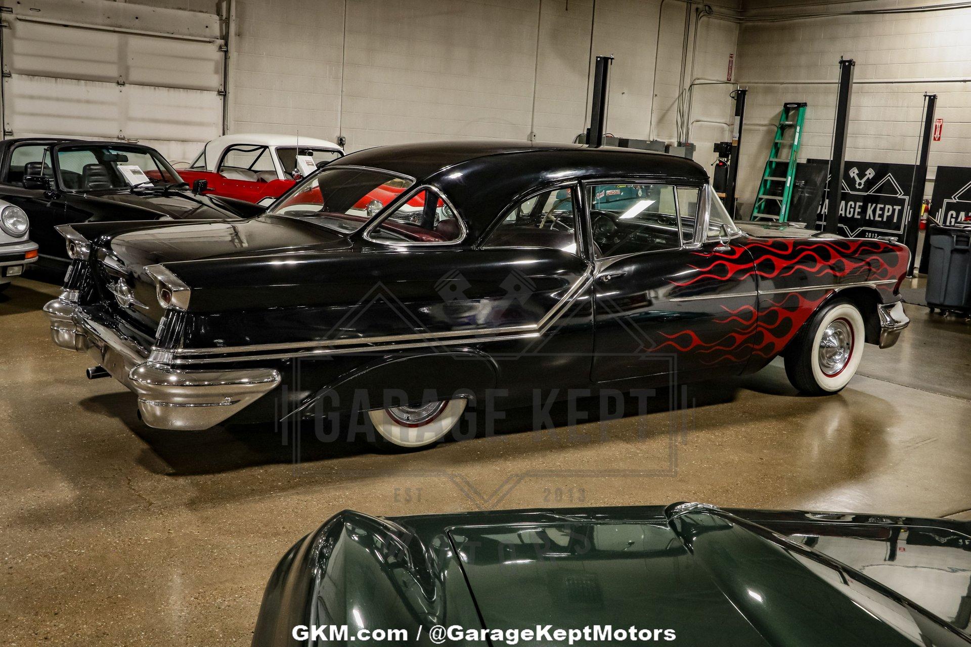 Unknown-Golden-rocket-88-1957-Black-Red-22