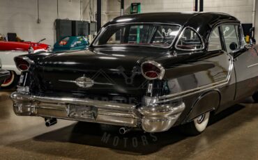 Unknown-Golden-rocket-88-1957-Black-Red-24