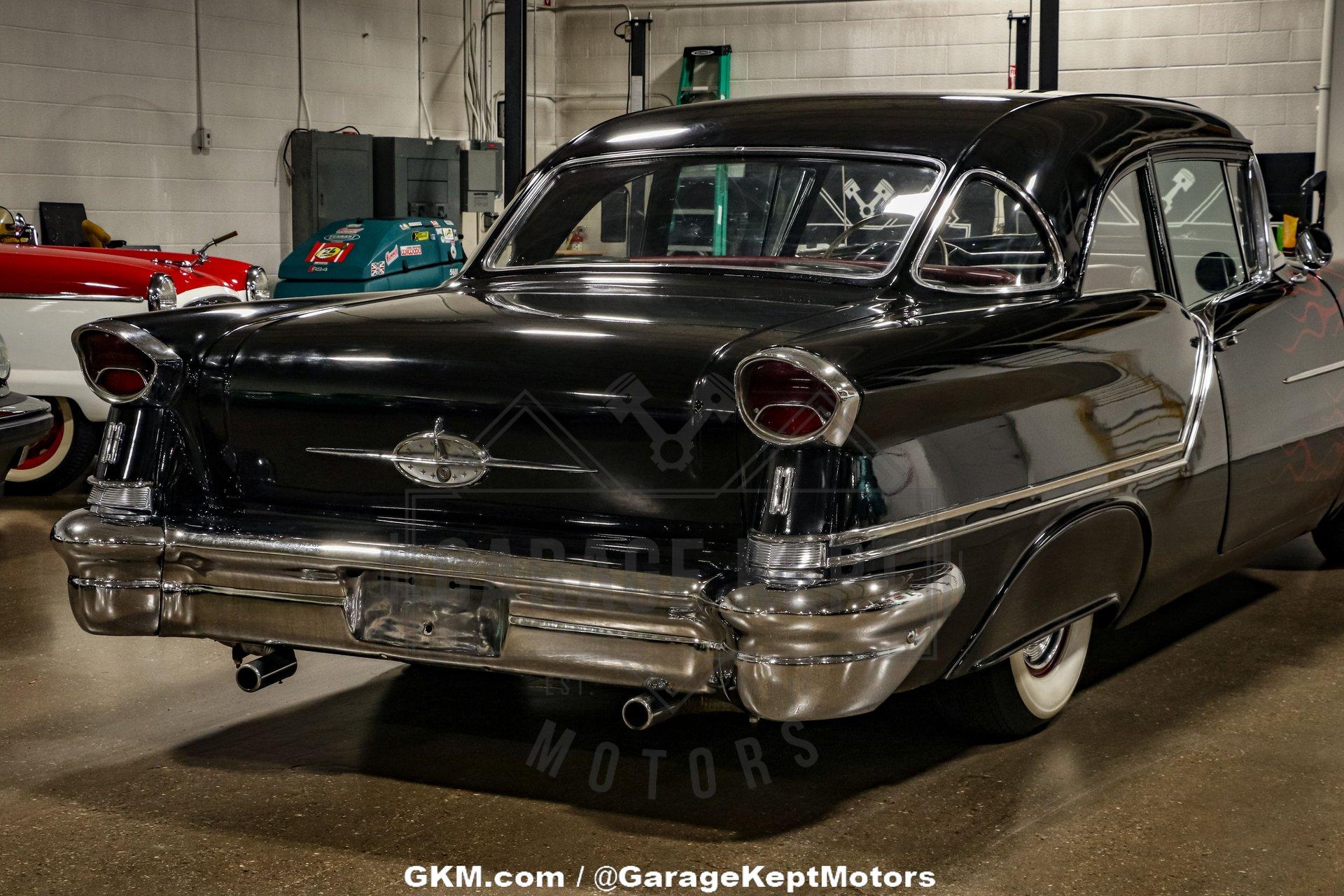 Unknown-Golden-rocket-88-1957-Black-Red-24