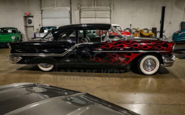 Unknown-Golden-rocket-88-1957-Black-Red-25