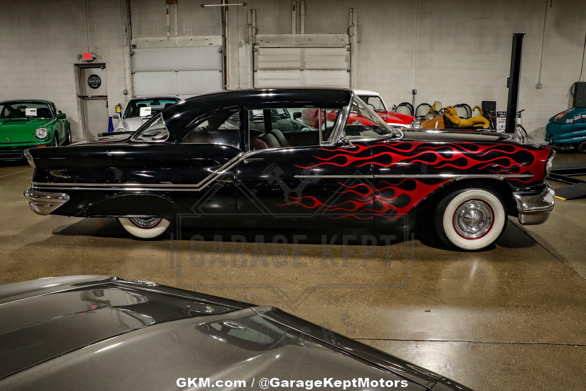 Unknown-Golden-rocket-88-1957-Black-Red-25