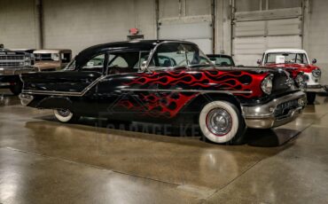 Unknown-Golden-rocket-88-1957-Black-Red-26