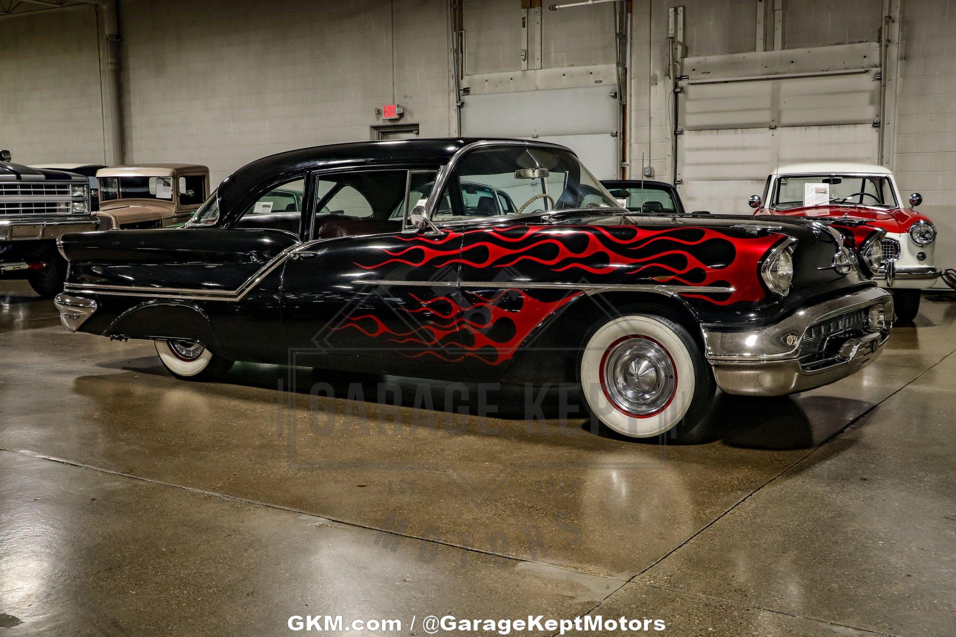 Unknown-Golden-rocket-88-1957-Black-Red-26