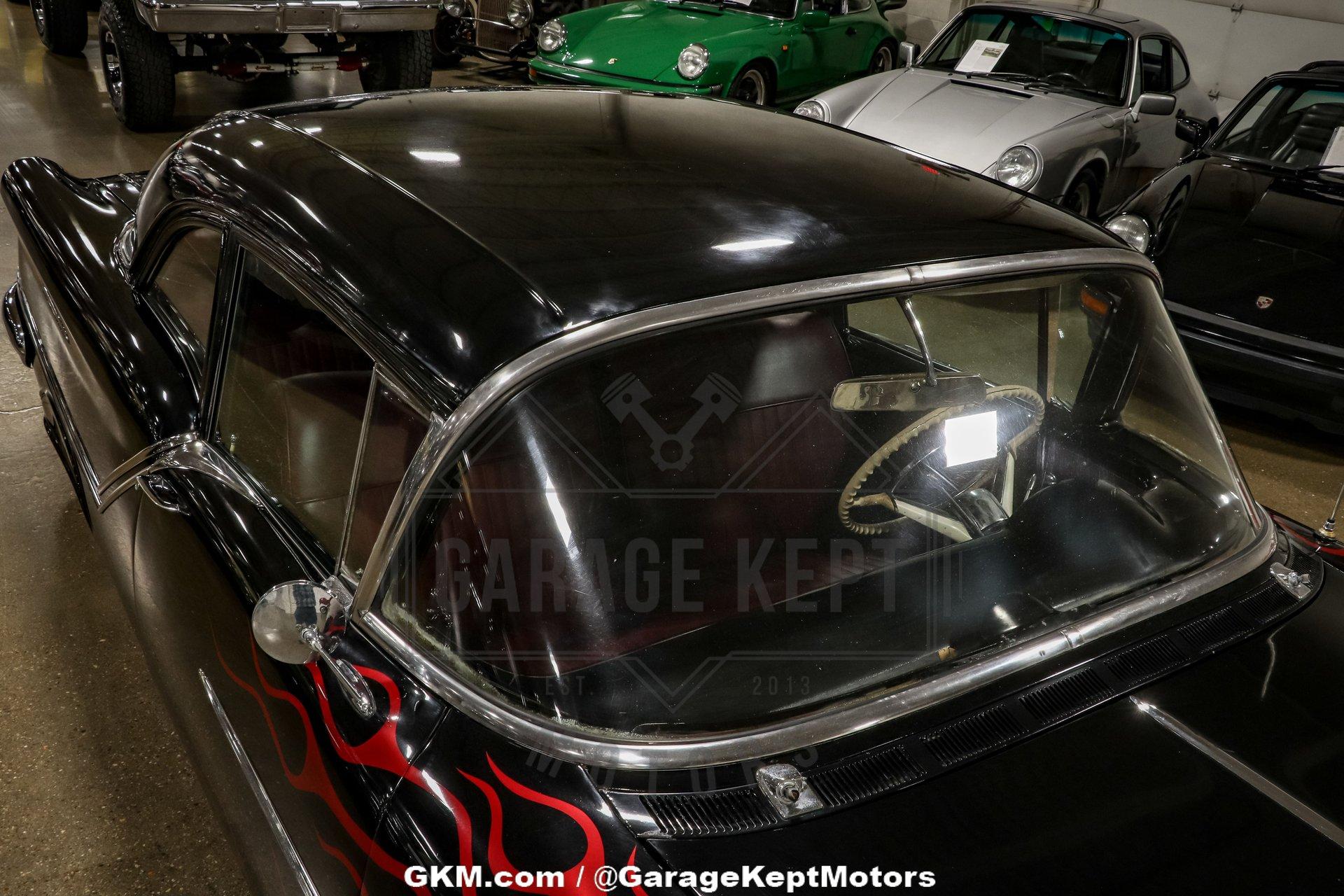 Unknown-Golden-rocket-88-1957-Black-Red-30