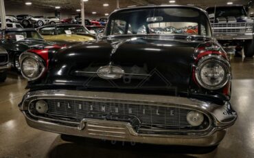 Unknown-Golden-rocket-88-1957-Black-Red-33