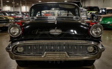 Unknown-Golden-rocket-88-1957-Black-Red-34
