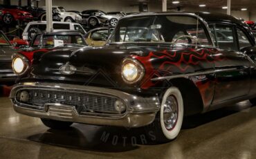 Unknown-Golden-rocket-88-1957-Black-Red-36