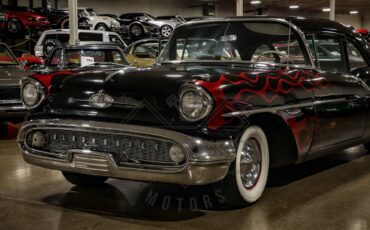 Unknown-Golden-rocket-88-1957-Black-Red-37