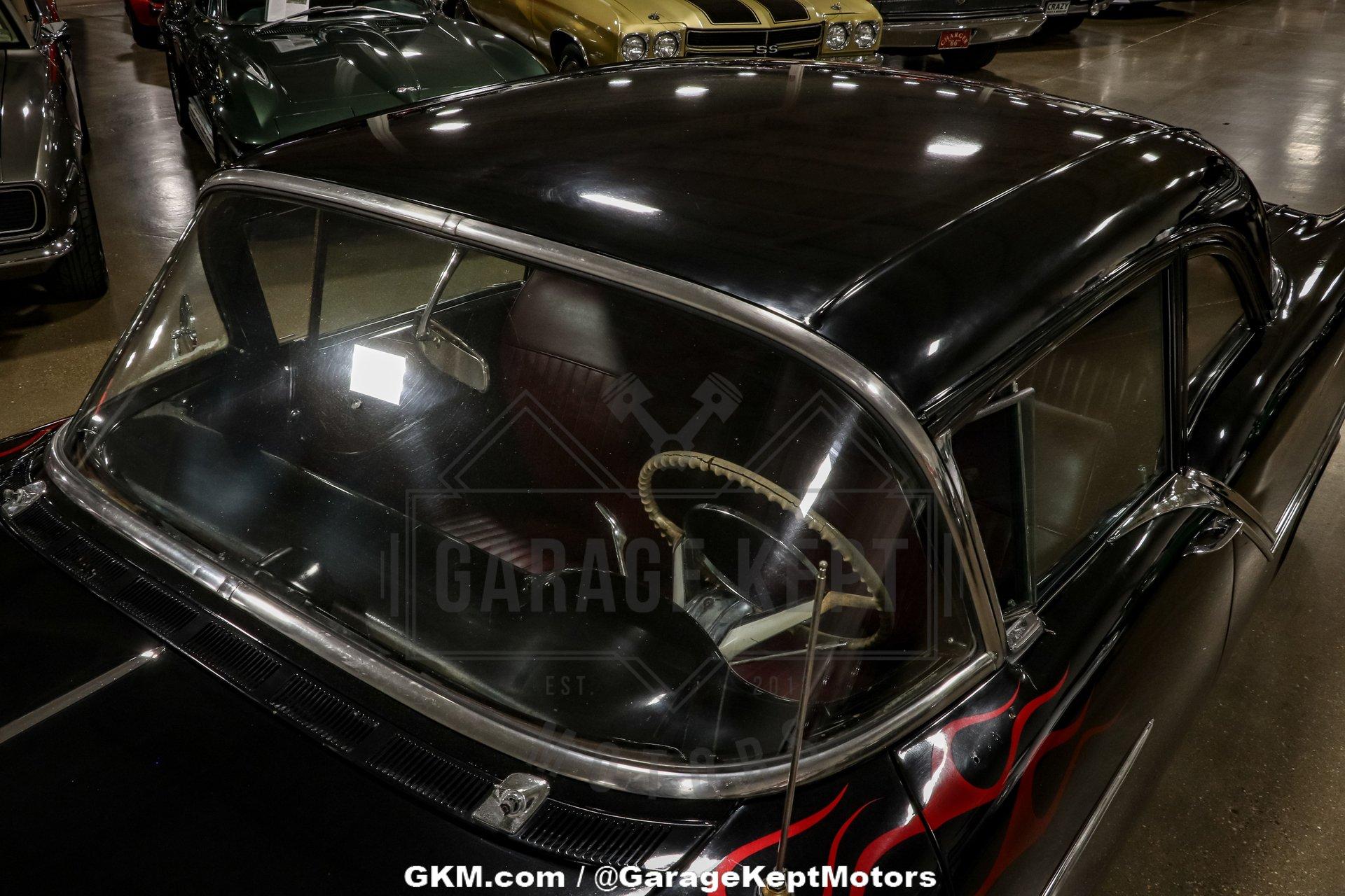 Unknown-Golden-rocket-88-1957-Black-Red-39