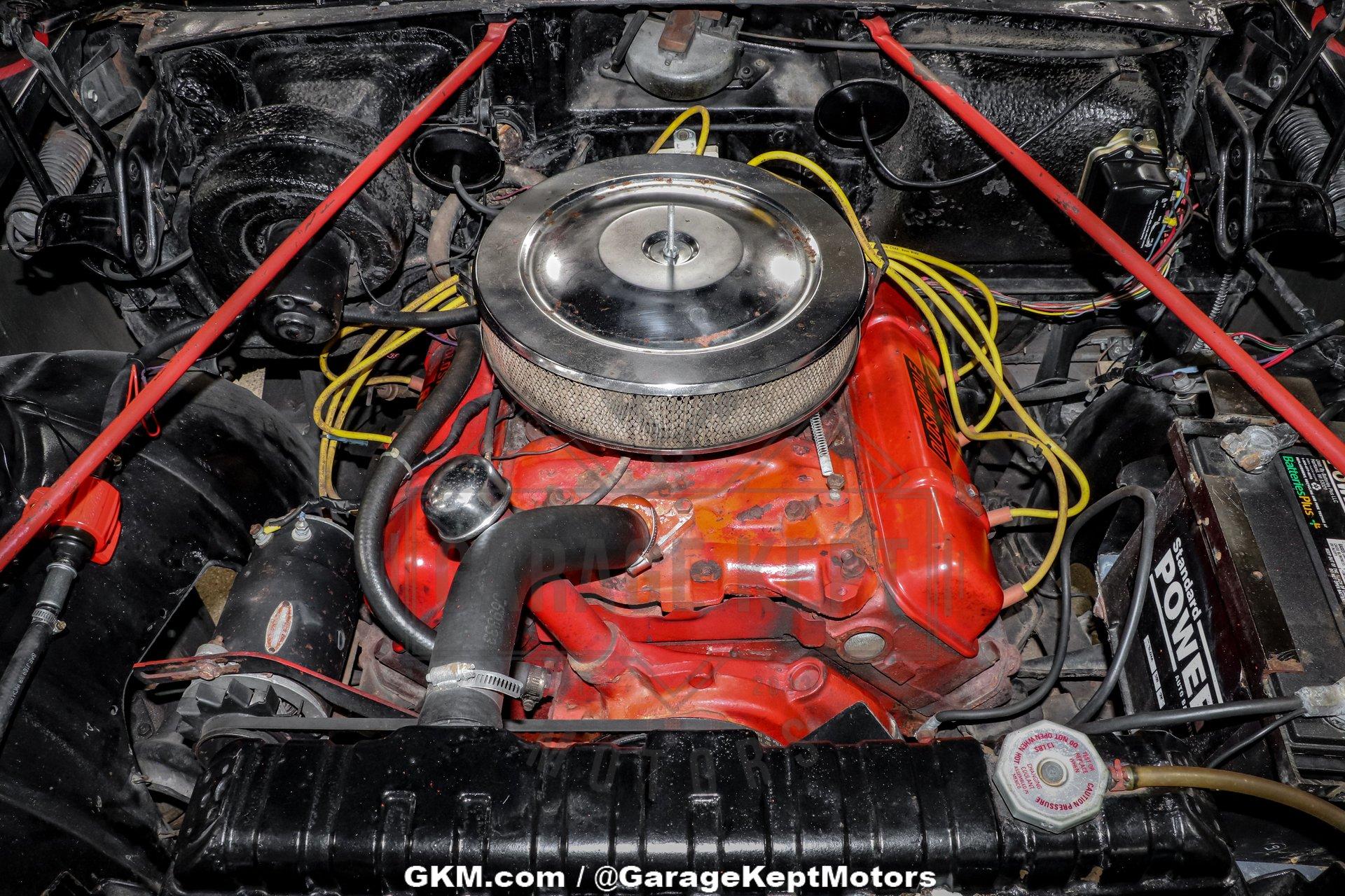 Unknown-Golden-rocket-88-1957-Black-Red-4