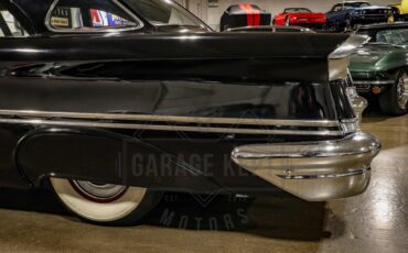 Unknown-Golden-rocket-88-1957-Black-Red-40