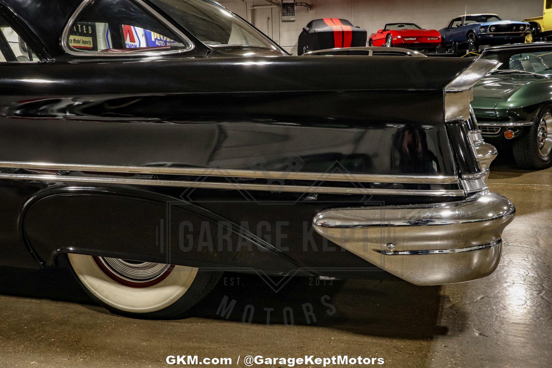 Unknown-Golden-rocket-88-1957-Black-Red-40