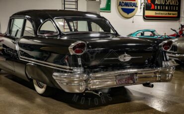 Unknown-Golden-rocket-88-1957-Black-Red-44