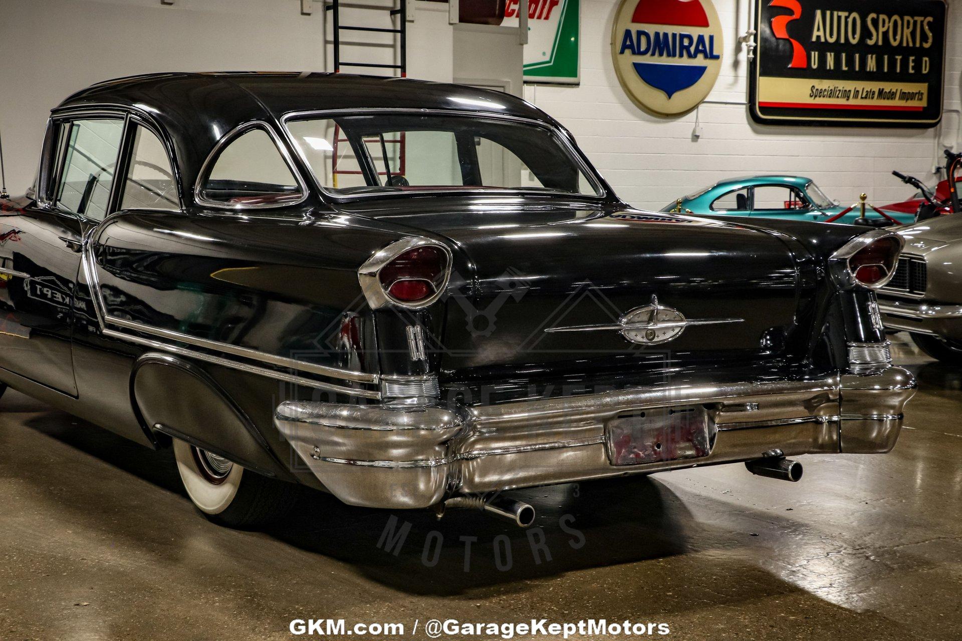 Unknown-Golden-rocket-88-1957-Black-Red-44