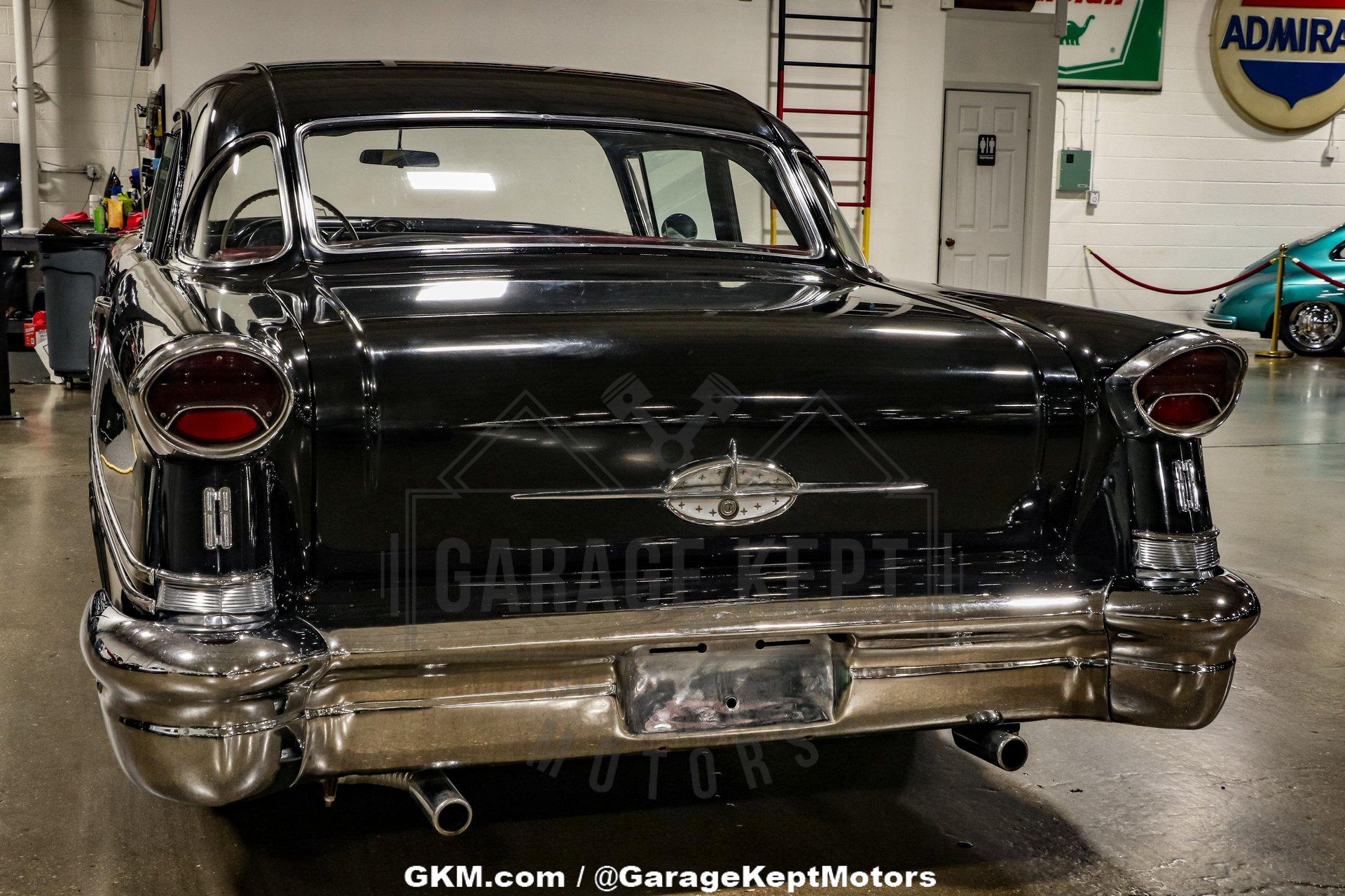 Unknown-Golden-rocket-88-1957-Black-Red-46