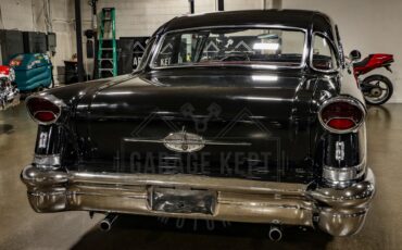 Unknown-Golden-rocket-88-1957-Black-Red-47