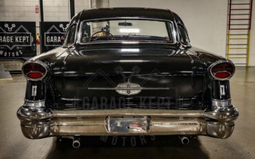 Unknown-Golden-rocket-88-1957-Black-Red-48