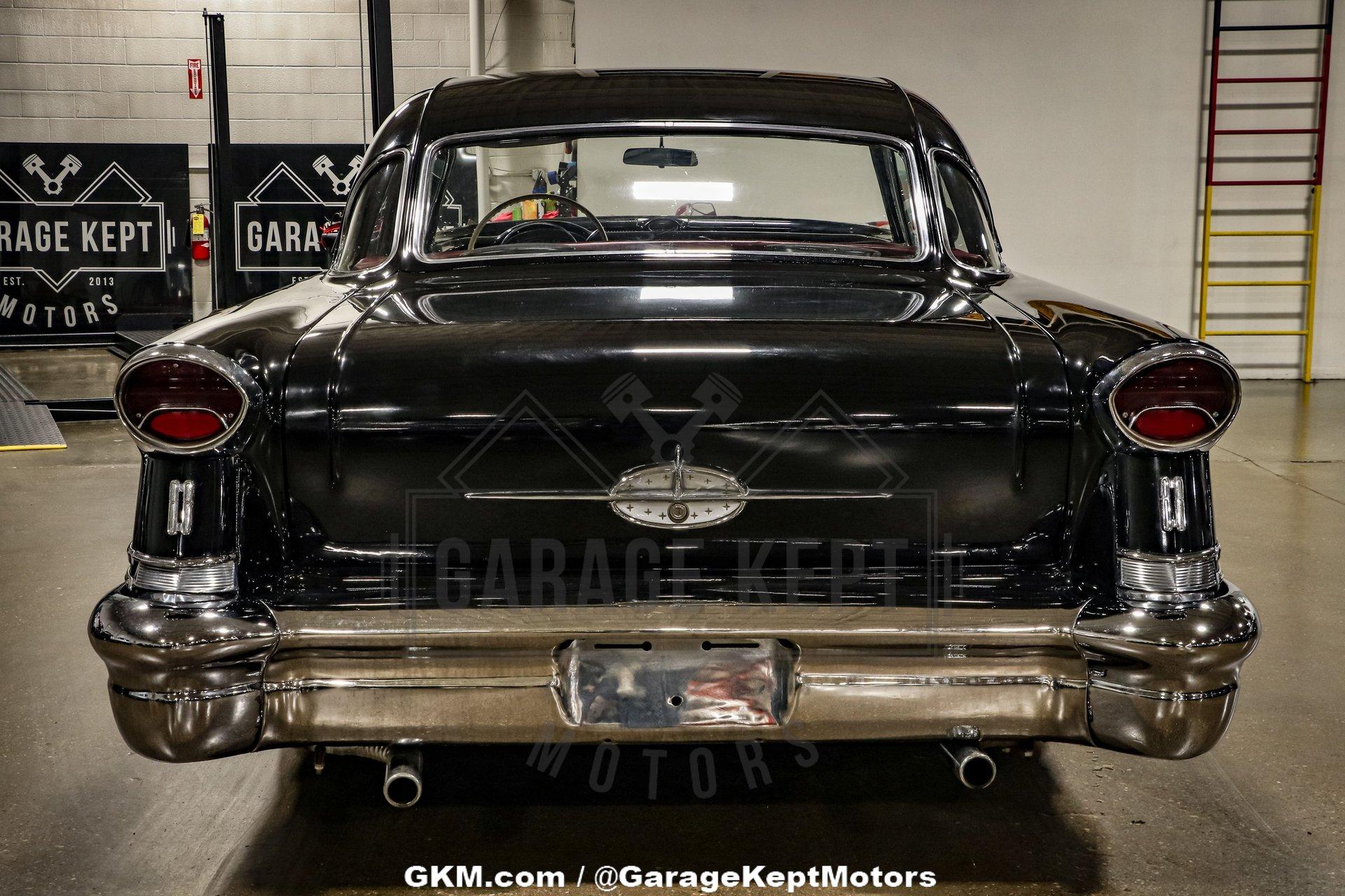 Unknown-Golden-rocket-88-1957-Black-Red-48
