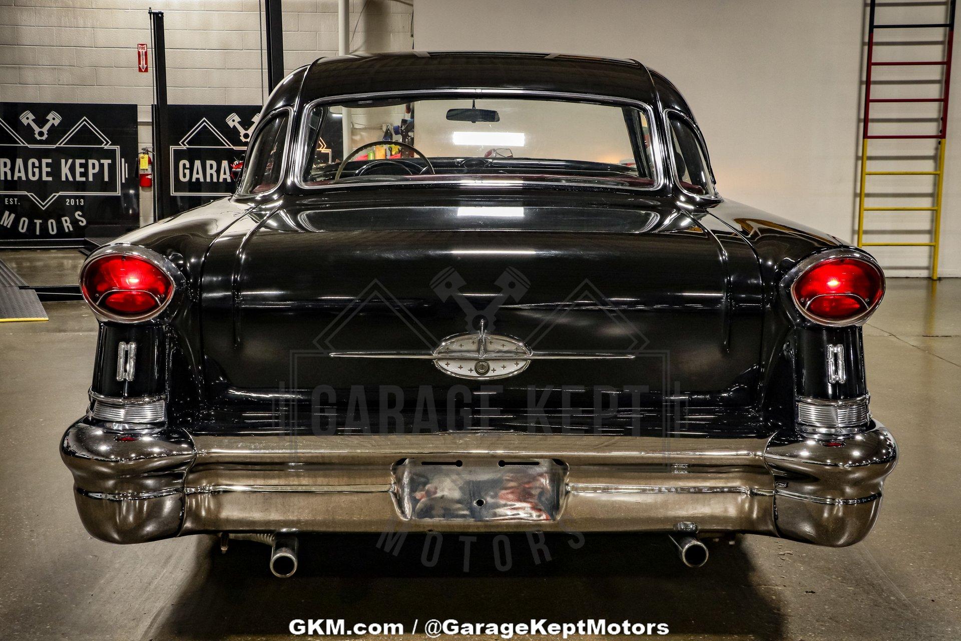 Unknown-Golden-rocket-88-1957-Black-Red-49