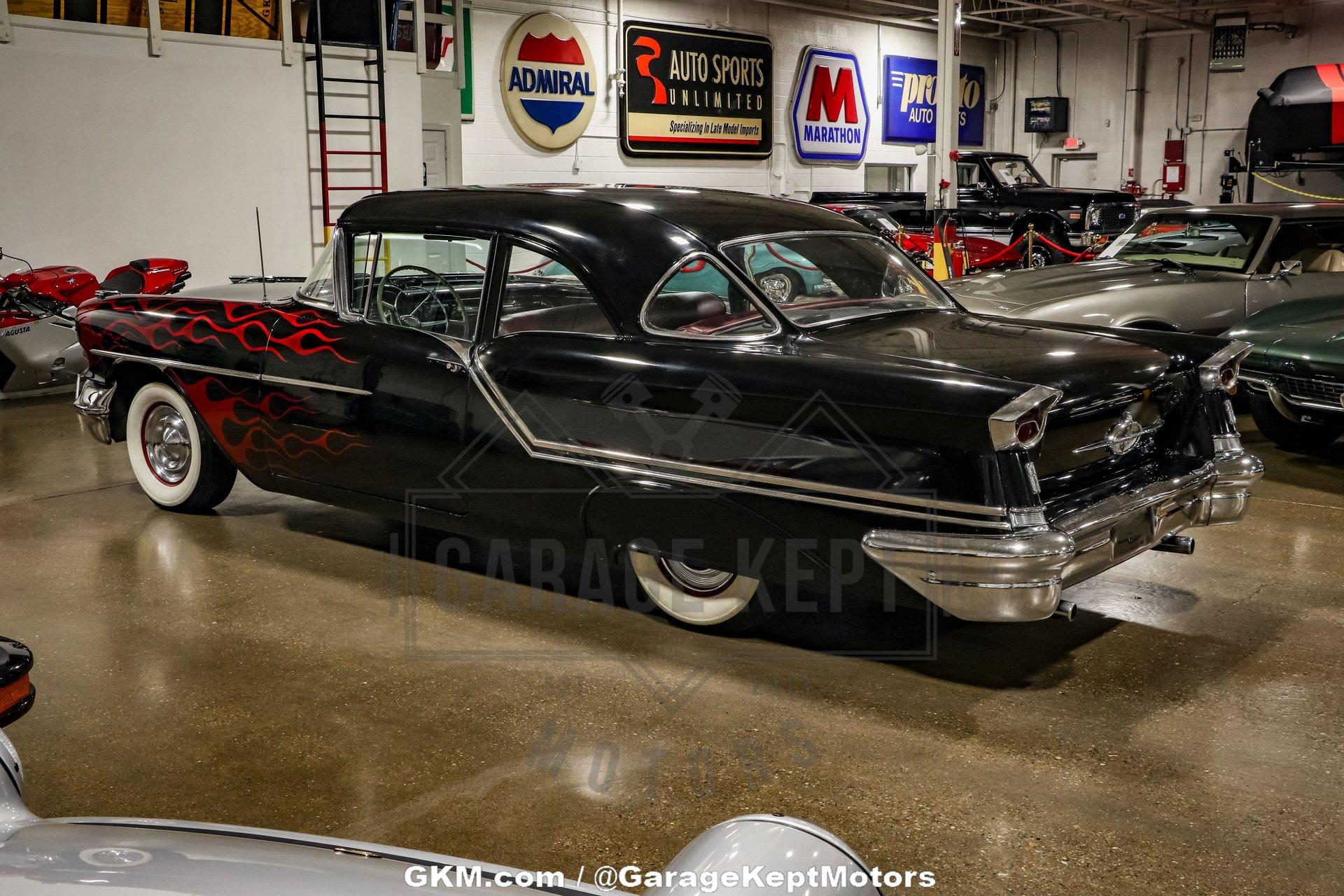 Unknown-Golden-rocket-88-1957-Black-Red-9
