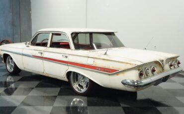 Unknown-Impala-1961-Patina-Red-ampamp-White-5